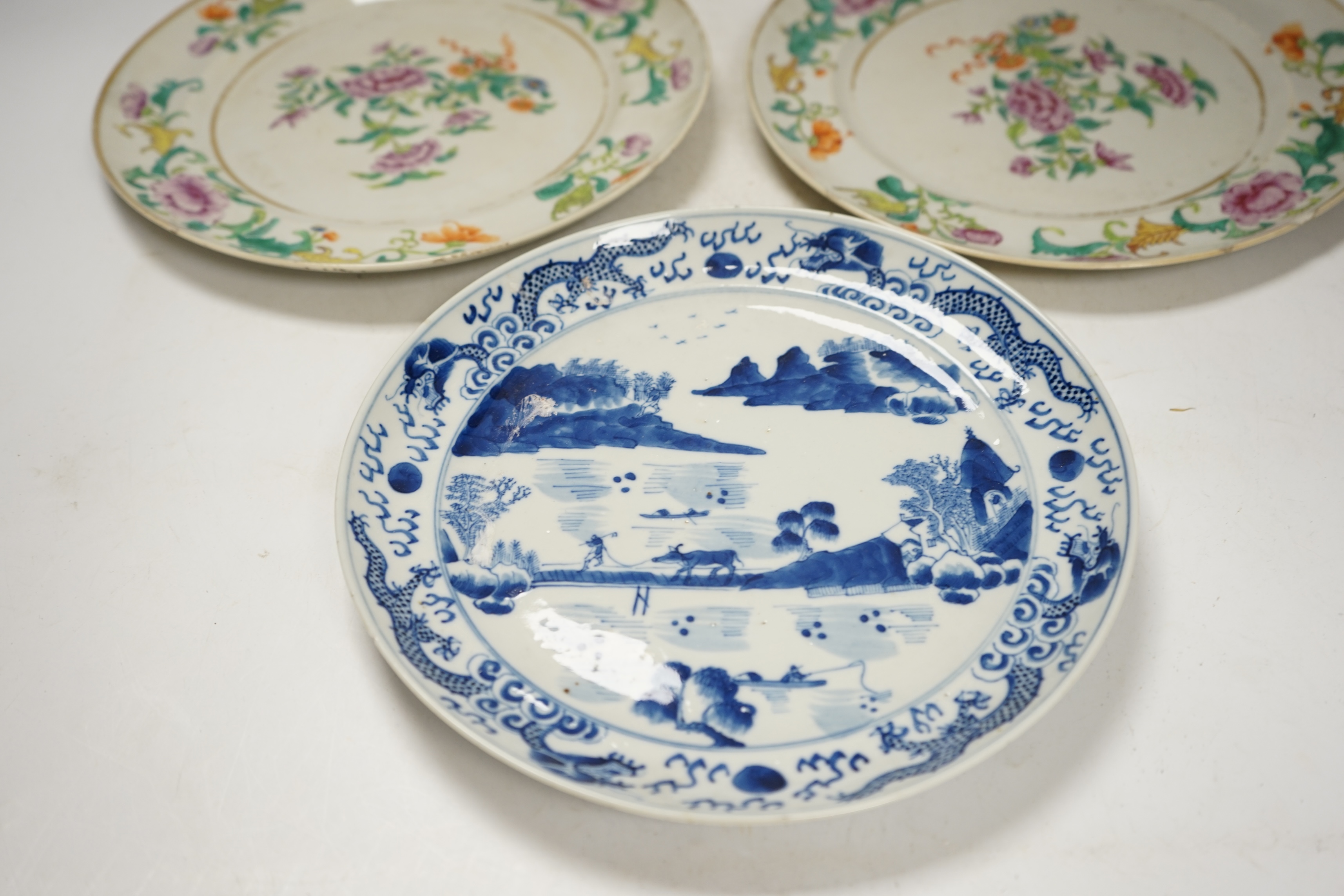 A pair of 19th century Chinese famille rose plates and another blue and white, largest 25cm diameter. Condition - blue and white good, others poor to fair